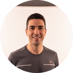 Circular portrait of Jason Ortega, a smiling male runner in athletic gear. He has short dark hair and is in his 30s, against 